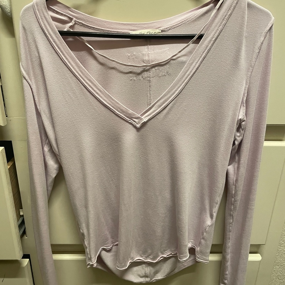 Free People shirt size small. Pink. In good condition.